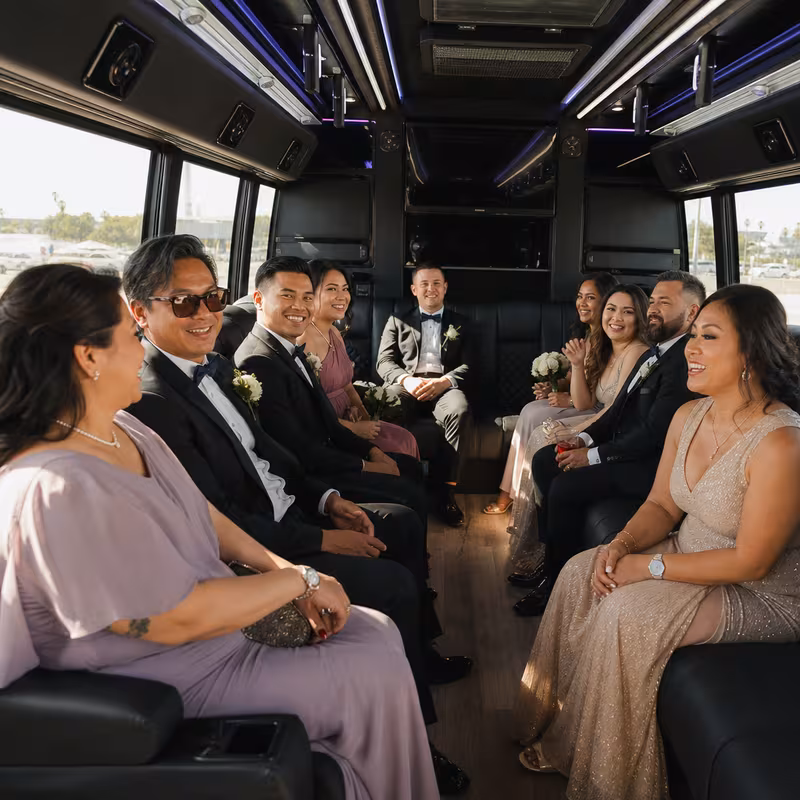 Wedding guests seated inside a Anaheim party bus