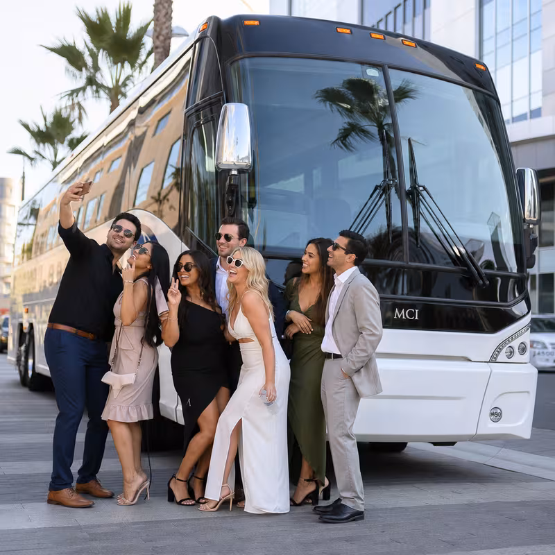 Passengers loading luggage while boarding an Anaheim group shuttle