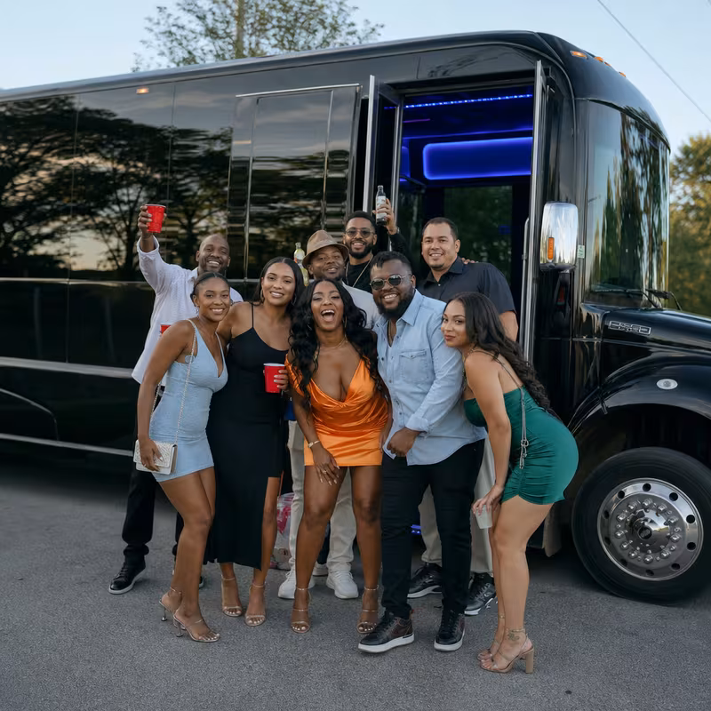 Party bus interior with wraparound leather seating and LED lighting in Anaheim