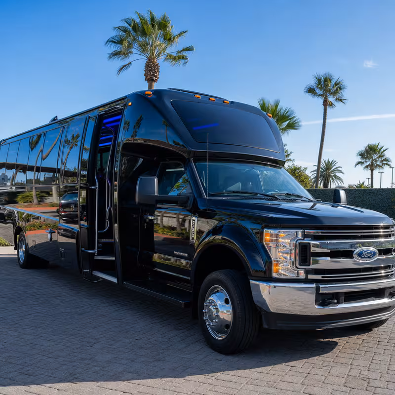 Party bus interior with wraparound leather seating and LED lighting in Anaheim