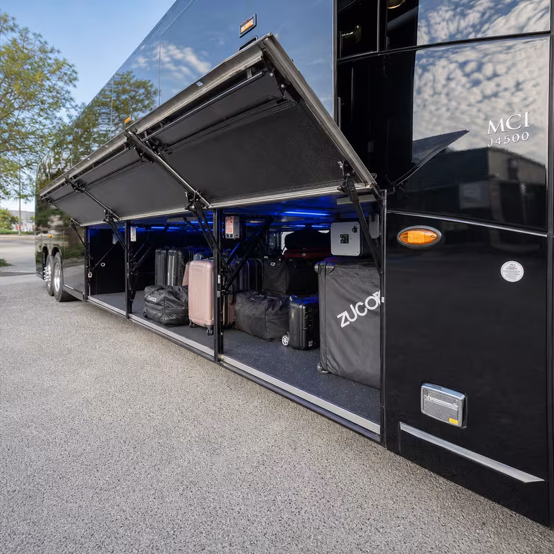 Party bus interior with wraparound leather seating and LED lighting in Anaheim